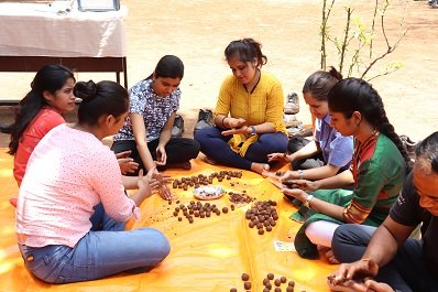 WOMEN EMPLOYEES AT CEAT LTD PLANTS PARTICIPATING IN SEED BALL ACTIVITY ON THE OCCASION OF WORLD ENVIRONMENT DAY CELEBRATING THE THEME `ONLY ONE EARTH .' - Copy