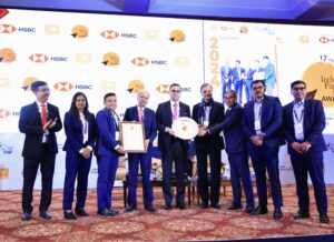 Senior leadership of Muthoot Microfin Limited receiving the ‘Financial Inclusion Institution of the Year’ award